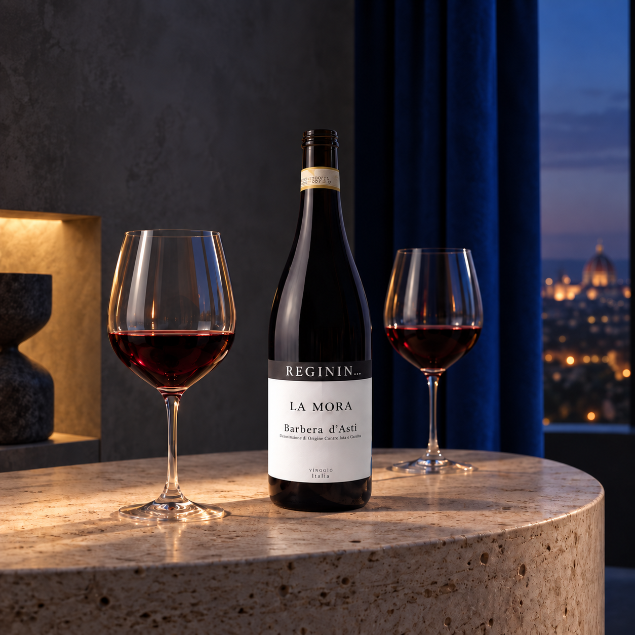Open La Mora Barbera d'Asti bottle with two dark ruby glasses in a modern evening interior