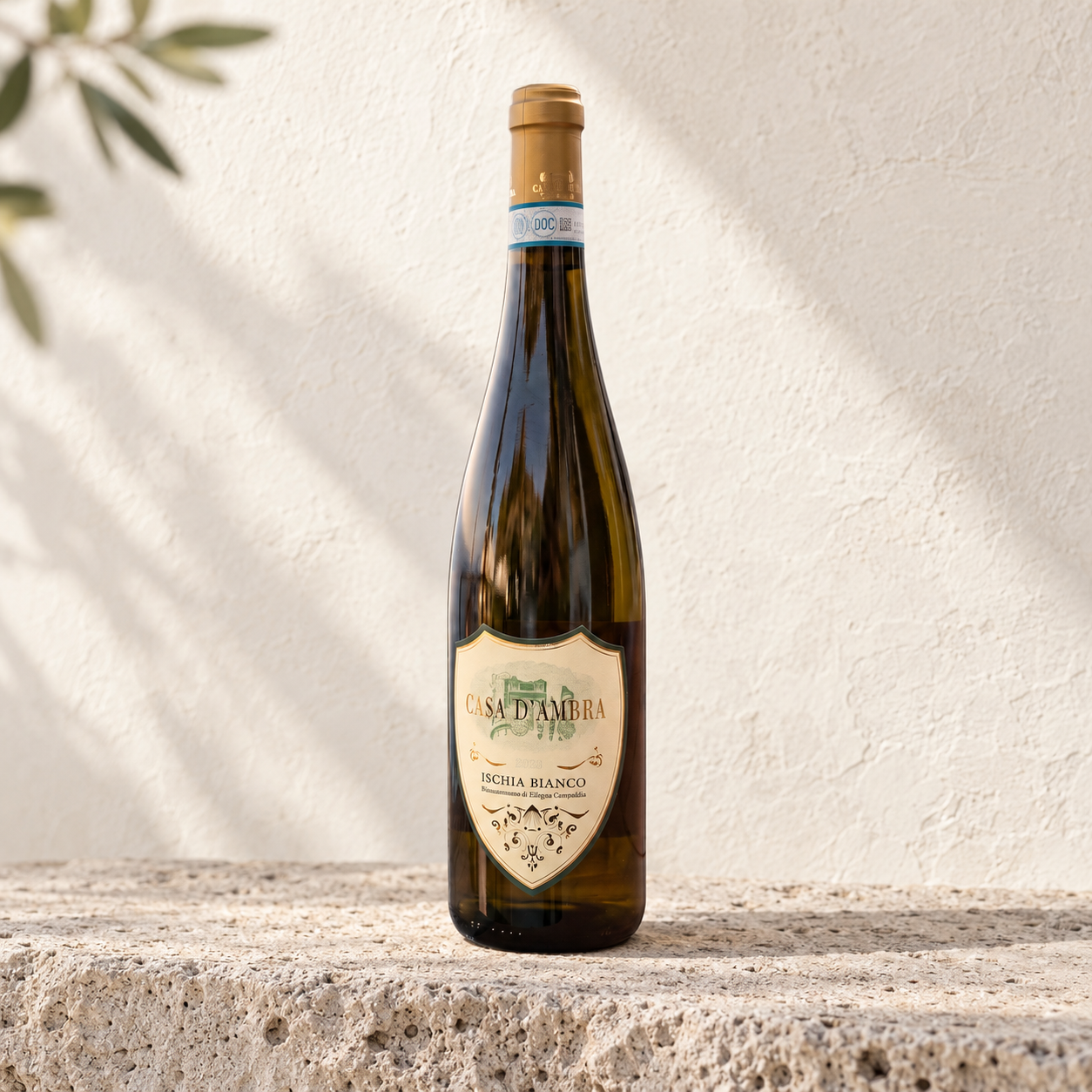 Casa D'Ambra Ischia Bianco bottle on pale volcanic stone