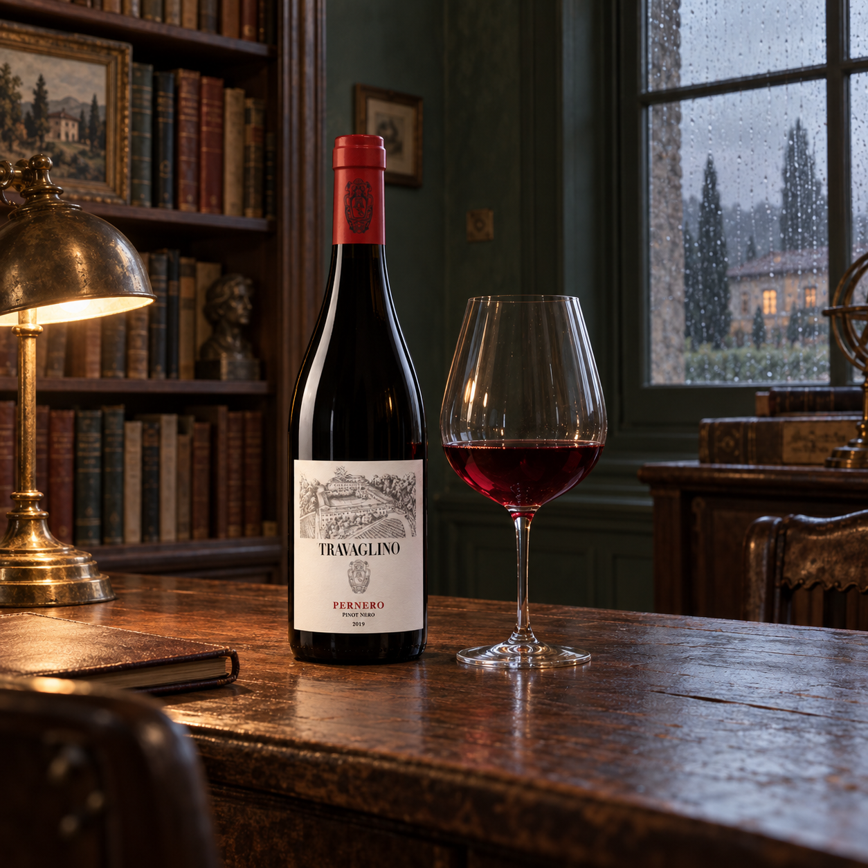 Tenuta Travaglino Pernero Pinot Nero bottle and red wine in the estate library